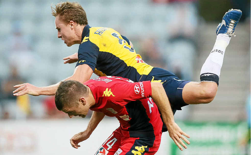 MAKING HIS PRESENCE FELT: Mariners defender Zac Anderson dives over Adelaide United midfielder Cameron Watson earlier this year. MAKING HIS PRESENCE FELT: Mariners defender Zac Anderson dives over Adelaide United midfielder Cameron Watson earlier this year.